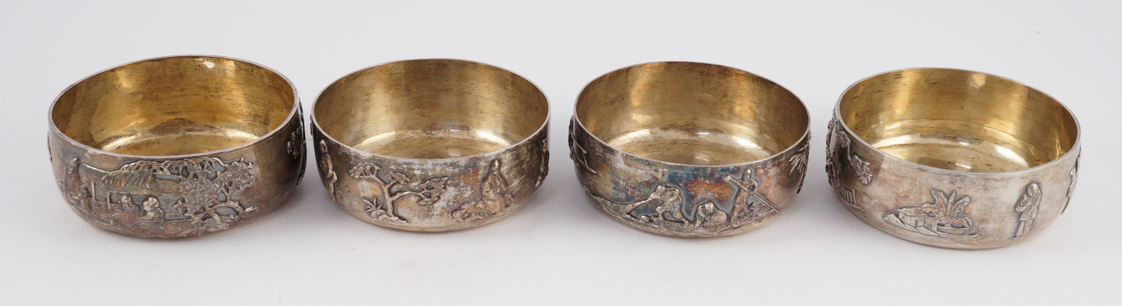 A set of four Chinese Export silver finger bowls, by Wang Hing, Hong Kong and one other set of four Chinese Export silver finger bowls